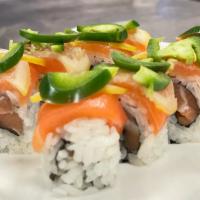 Cosmopolitan Roll · Fresh salmon roll topped with fresh salmon, lemon, jalapeño, and house sauce