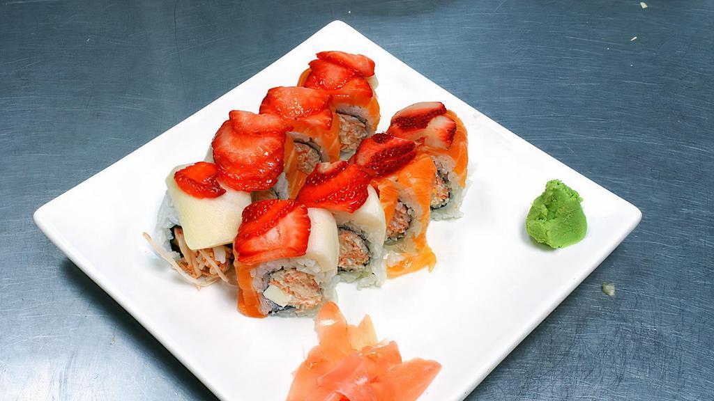 Strawberry Field Roll · Snow crab with cream cheese topped with salmon, white tuna, and strawberry served with special sauce.