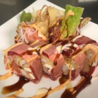Mj Roll · Riceless with spicy tuna, cream cheese, tempura, shrimp, veggies, crab salad, and tobiko wra...