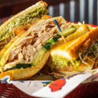 Turkey Guacamole · Sliced turkey piled on toasted sourdough with swiss cheese, tomato, alfalfa sprouts, cucumbe...