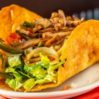 Fajita Salad · Salad greens with shredded cheese, grilled onions and peppers, diced tomatoes, guacamole and...