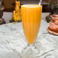 Mango Lassi · Blended with yogurt and mango pulp, rose water. Smooth drink, served cold.