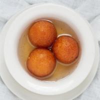 Gulab Jamun · Two pieces. Sweet dumplings made from dried milk and dipped in sugar syrup.