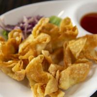 Crab Wontons · Crispy-fried wontons stuffed with a combination of imitation crab meat and cream cheese. Ser...