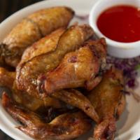 Chicken Wings · Our tasty chicken wings are marinated in a garlic and soy sauce. Served with a sweet and sou...