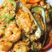 Stir Fried Seafood With Curry Powder · Prawns, scallops, calamari, and mussels stir fried with yellow curry, egg, celery, bell pepp...