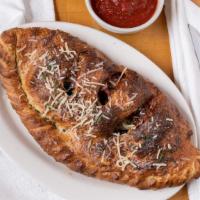 Twilight Zone Calzone · Salami, pepperoni, mushrooms, onions and olives