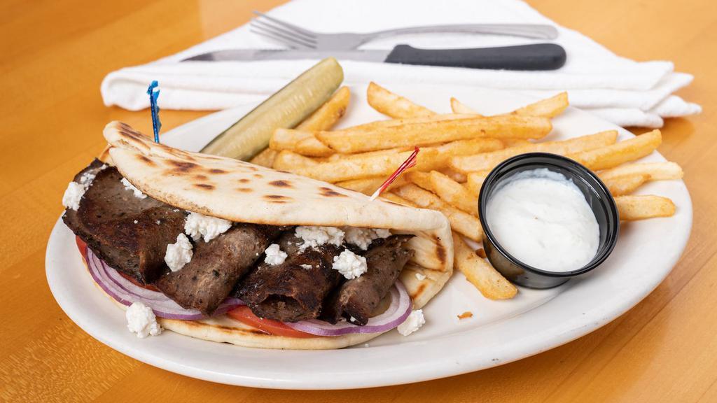 Big Lamb & Beef Gyro (Our Best-Selling Item) · Strips of gyro meat, house made cucumber tzatziki, cucumber, lettuce, fresh tomato, red onions and feta cheese on a grilled pita. Served with Oregon kettle chips and a spicy pub pickle