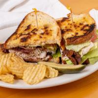 The Club Sandwich · Pub brined turkey breast and lots of thick hickory bacon, lettuce, tomato, onion and our 100...