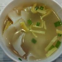 Wonton Soup · Meat dumplings with eggs and BBQ pork in a clear broth.