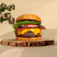 Bacon Breaker Vegan Burger · Seasoned plant-based patty topped with melted vegan cheese, layers of crispy vegan bacon, le...