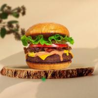 Classic Bite Vegan Burger · Seasoned plant-based patty topped with lettuce, tomato, onion, and pickles. Served on a warm...