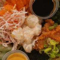 Poke Bowl · Spicy Tuna, Crab Salad, Seaweed Salad, Corn ,Masago,
Cucumber salad, Assorted Vegi on bed of...