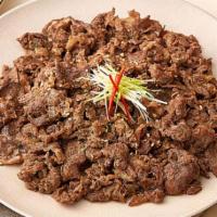Bulgogi Beef · Korean BBQ beef on bed of white rice serves