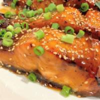 Teriyaki Salmon · Grilled Salmon on bed of white rice serves