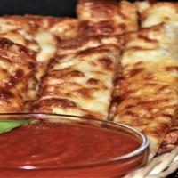 Fire Sticks · New. 16 pieces off beer batter breadsticks with buffalo hot sauce baked in. Served with ranc...