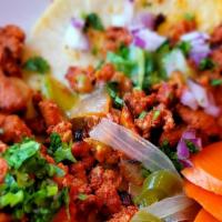 Taco · Choice of meat (pastor, asada, chicken, chorizo, carnitas, birria, tripa, lengua) served on ...
