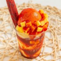 Mangonada · House-made mango sorbet, chamoy, tajin, fresh mango, tamarind stick.