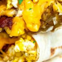 Breakfast Burrito · A delicious burrito with beans, eggs, potato and your choice of meat with cheese and pico de...