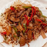 Mongolian Beef · Smoked beef, crispy noodle, sesame, chili flakes, bamboo shoot, and bell pepper. Served over...