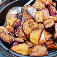 Caramelized Eggplants In Clay Pot · Fried tofu, straw mushrooms, eggplants, black pepper, and coconut juice.