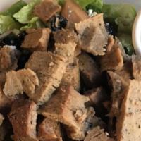 Lamb Gyro Salad · Marinated rotisserie lamb served on a bed of romaine lettuce topped with tomatoes, cucumber,...