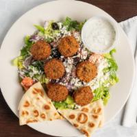 Falafel Salad · Falafel patties served on a bed of romaine lettuce topped with tomatoes, cucumbers, and oliv...
