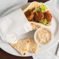 Falafel · Falafel patties, tomatoes, onions, romaine lettuce, parsley, and tzatziki wrapped in pita br...