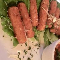 Mozzarella Cheese Sticks · Battered mozzarella cheese logs fried golden brown and served with choice of marinara or ran...
