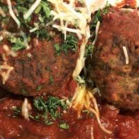 Meatballs · Two baseball sized meatballs sautéed in marinara sauce and topped with basil, parsley, and s...