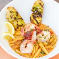 Penne Ala Vodka · Penne pasta tossed in a creamy vodka sauce topped with sundried tomatoes with a little bit o...