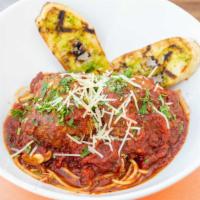 Spaghetti & Meatballs · Two baseball sized homemade meatballs served on a bed of spaghetti smothered in marinara sau...