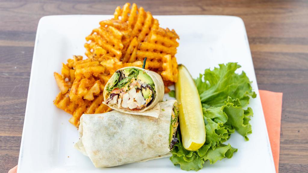 California Chicken Wrap · Grilled chicken, applewood bacon, spring mix, tomatoes, onions, avocado, cheddar jack cheese with chipotle ranch wrapped in a spinach tortilla.