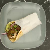 Falafel Pita · A vegetarian, dish blend of garbanzo beans, vegetables and seasonings, deep-fried and served...