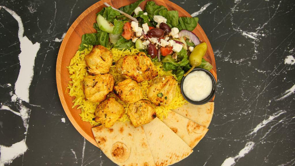Chicken Kabob Plate · Juicy all-white meat chicken kabobs with homemade marinade, with choice of 2 sides. Served with a sauce, and pita bread.