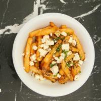 Feta Fries · Our crispy fries topped with feta cheese, and homemade Dressing sauce. They are simply irres...