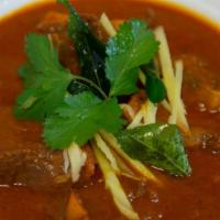 Goat Curry · Succulent cut of goat on the bone cooked in traditional way in a rich curry sauce.