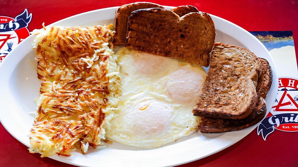 Basic Breakfast · 2 Eggs served with hash browns and choice of toast