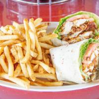 Grilled Chicken Wrap · Marinated sliced grilled chicken breast, greens, avocado, and Italian dressing in a flour to...