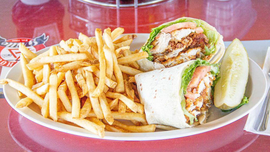 Grilled Chicken Wrap · Marinated sliced grilled chicken breast, greens, avocado, and Italian dressing in a flour tortilla