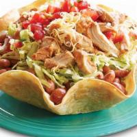 Taco Salad · Crispy baked in house taco salad shell filled with shredded lettuce, beans, and your choice ...