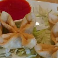 Crab Rangoon (6) · Crab meat and cream cheese in a golden wonton skin (6).