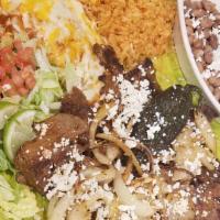 Carne Asada · A flavorful, Mexican- style char-broiled steak marinated in a mouth-watering blend of spices...