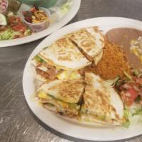 Fajita Quesadilla · A grilled flour tortilla stuffed with cheese, peppers, onions and mushrooms grilled with you...