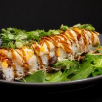 Seahawks Roll · Salmon and cream cheese topped with seared albacore, unagi sauce and green scallions served ...