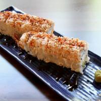 Geisha · Tempura shrimp, cream cheese, avocado, sushi rice, nori, with imitation crab, eel sauce on top