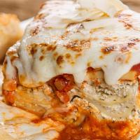 Lasagna · Homemade from the family recipe, layers of ribbon noodles and three cheeses, smothered in ma...