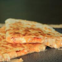 Buffalo Chicken Quesadilla · Buffalo chicken, blue cheese crumbles, shredded cheddar, diced tomato, and blue cheese dress...