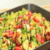 Alibaba Salad · Fresh romaine, avocado chunks, roasted corn, roasted edamame, diced tomatoes, and balsamic v...