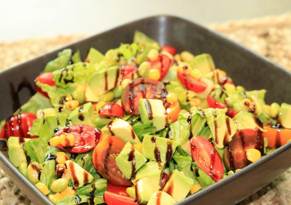Alibaba Salad · Fresh romaine, avocado chunks, roasted corn, roasted edamame, diced tomatoes, and balsamic vinaigrette.
